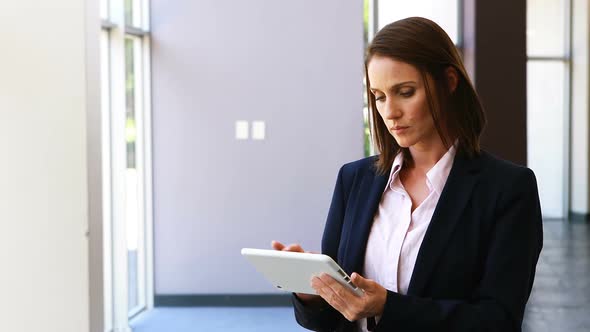 Businesswoman using digital tablet in office 4k