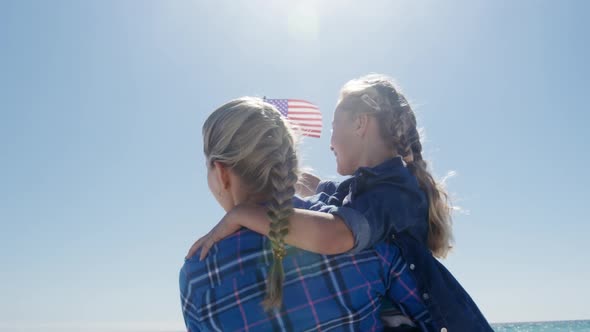 Woman and her daughter enjoying free time on the beach together