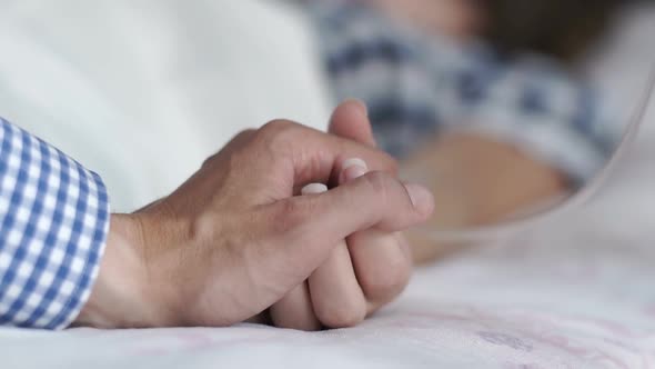 The Doctor Installs a Catheter to a Woman Who is in the Hospital