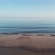 The camera slowly scrolls across the beach during sunrise. - VideoHive Item for Sale
