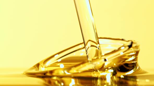 A Jet of Olive Oil Falls with Splashes