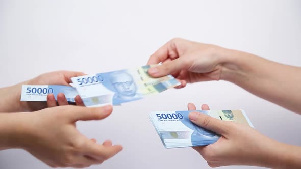 Giving and Receiving Indonesian Money One by One