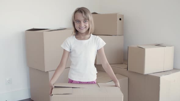 Joyful Girl Posing in New Apartment