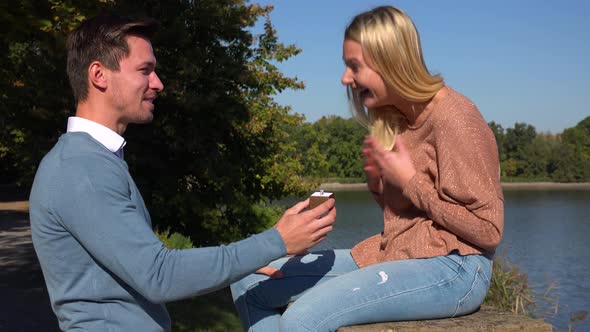 A Man Proposes To His Girlfriend in a Park