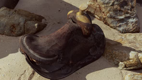 Very Old Horse Saddle on Sand Beach