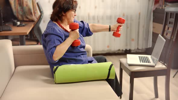 Old Granny Workout With Dumbbells On Home. Elderly Older Woman Wellness Healthy Lifestyle.