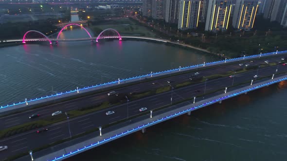 Aerial Orbital View on the Road Bridge and the Footbridge in the Modern City