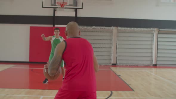 Basketball Player Committing Offensive Foul of Charging