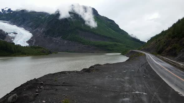 British Columbia Highway winding through the mountains by Strohn Lake in Bear Glacier Provincial Par