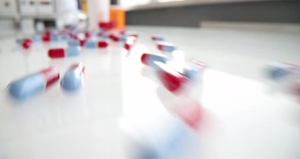 Various Medical Pills are Scattered on Table