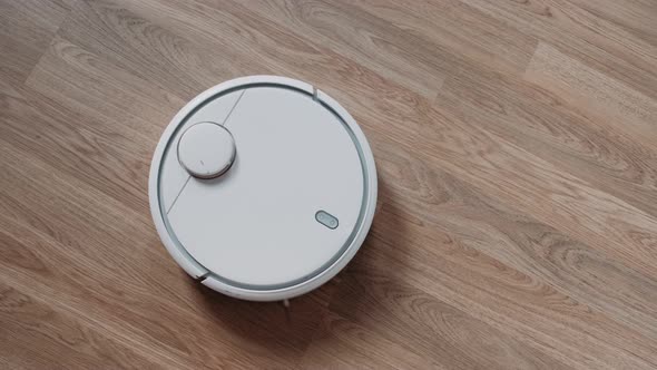 Vacuum Robot auto cleaning at home. Smart Home. Housekeeping.