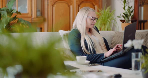 Businesswoman Doing Home Office Work on Laptop Computer