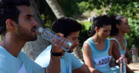 Marathon athletes having water 4k