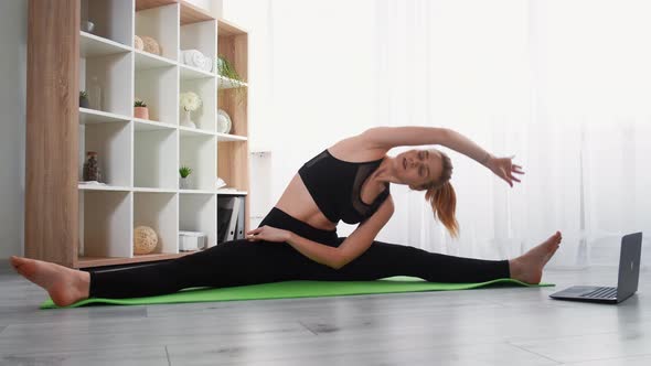 Sport at Home Internet Workout Woman Stretching