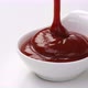 Pouring ketchup in bowl on white background - VideoHive Item for Sale
