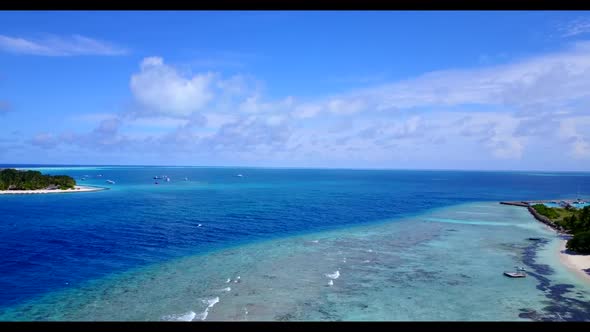 Aerial drone view sky of tropical tourist beach wildlife by aqua blue water with white sandy backgro