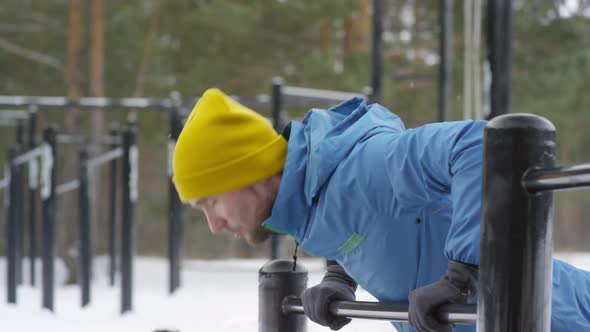 Active Man Doing Push-Ups at Outdoor Gym