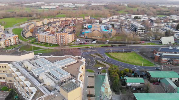 Reverse aerial view of Gloucester Park and Basildon Town Centre in the morning