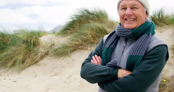 Senior man in sweater feeling cold