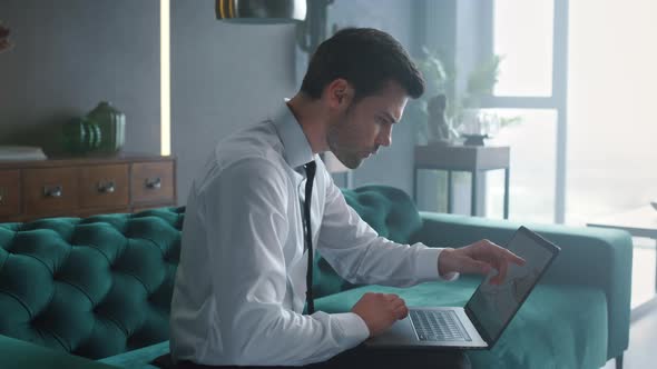 Business Man Working on Laptop at Office, Manager Looking at Charts on Computer