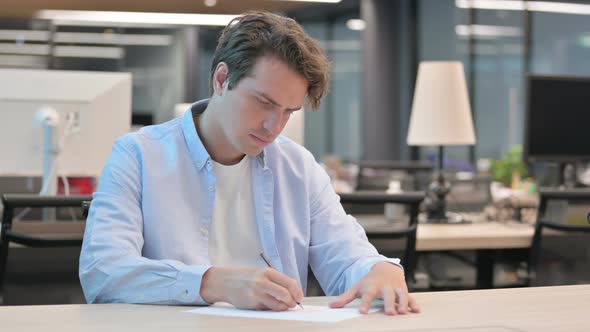 Man Having Failure While Writing on Paper