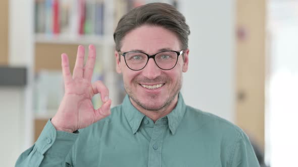 Middle Aged Man Showing Ok Sign By Hand