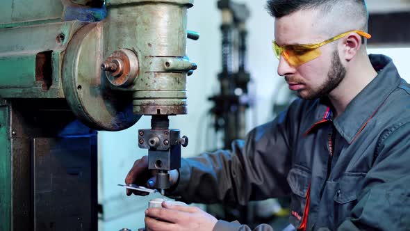 Factory worker at industrial facilities. Industrial machine operator working in factory