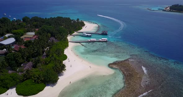 Natural aerial abstract shot of a sandy white paradise beach and aqua turquoise water background in 