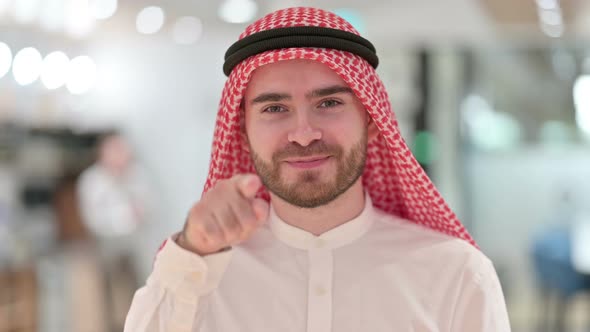 Portrait of Assertive Arab Businessman with Pointing at the Camera