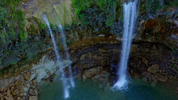 Cascading twin falls into freshwater pool, Caribbean; stunning aerial riser