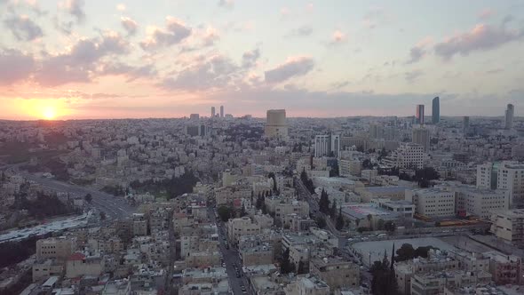 Beautiful aerial clip taken by a drone panning to the right showing early morning with a newly-risen