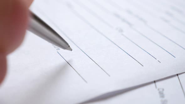 Man signs document close-up