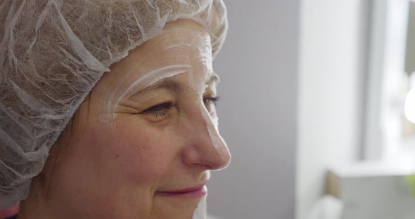 Close Up of Old Woman Applied Makeup Visage By Her Makeup Skin Care Applying Cream