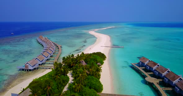 Natural aerial travel shot of a sunshine white sandy paradise beach and blue water background in hig