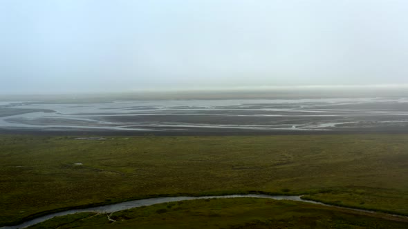 Aerial Drone View Of Flat Volcanic Plains In Southern Icelandic Coast During Foggy Day