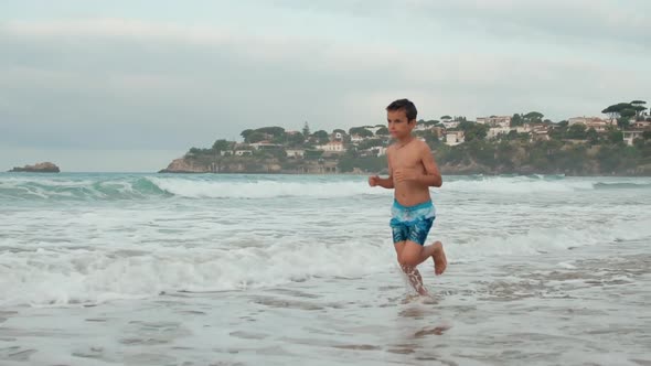 Happy Boy Enjoying Summer Vacation at Seaside