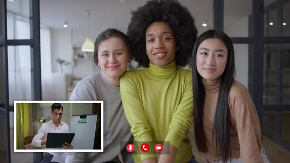 Team of Young Cheerful Multiethnic Women Looking at Webcamera As Confident Concentrated Man in Web