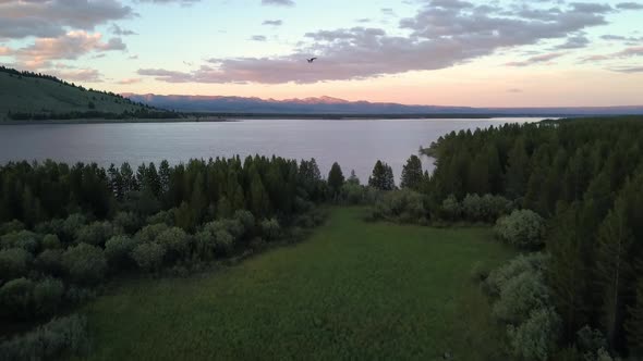 Aerial view flying over Hebgen Lake at dusk