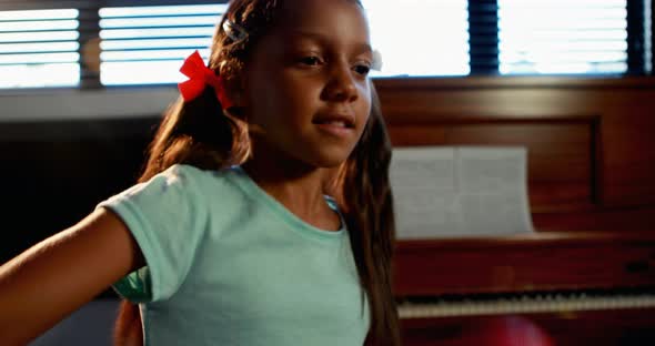 Schoolgirl playing maraca in music class 4k