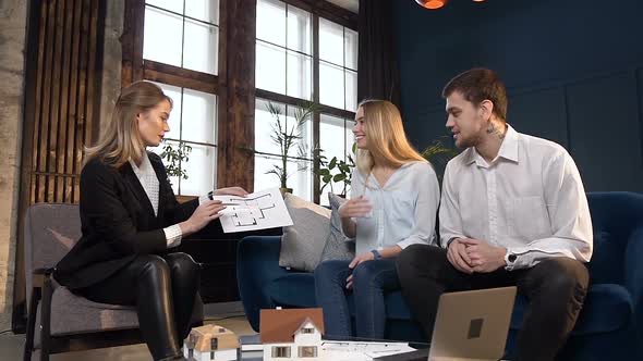 Young Couple on the Meeting with Architect