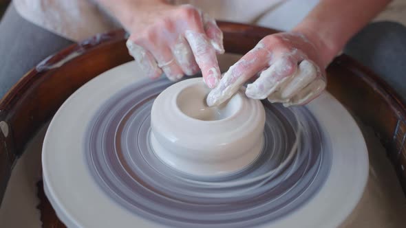 Female Potter's Hands Modeling Clay