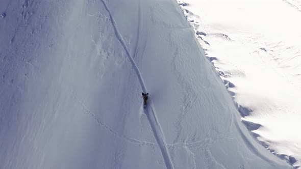 Snowboarder Solo Steep Run