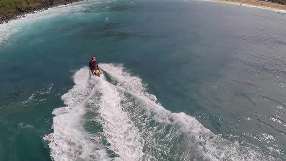 Aerial view of lifeguard surf rescue jetski personal watercraft in Hawaii