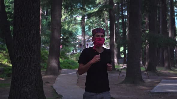 An American Jogging While Having a Pink Home-made Face Mask on During Corona Times 