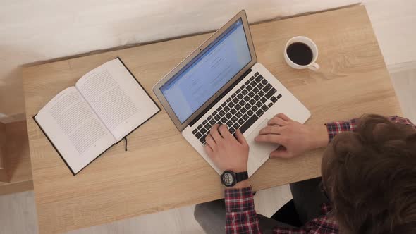 Man with laptop. Business man typing on laptop computer working in internet. Online job in office.