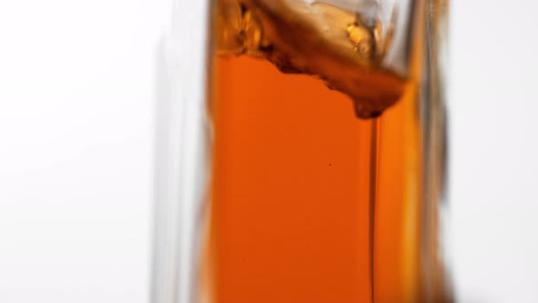 Seeds colliding against oil stream. Slow Motion. alt