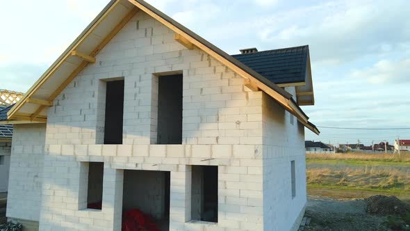 Aerial View of Unfinished House with Aerated Lightweight Concrete Walls and Wooden Roof Frame