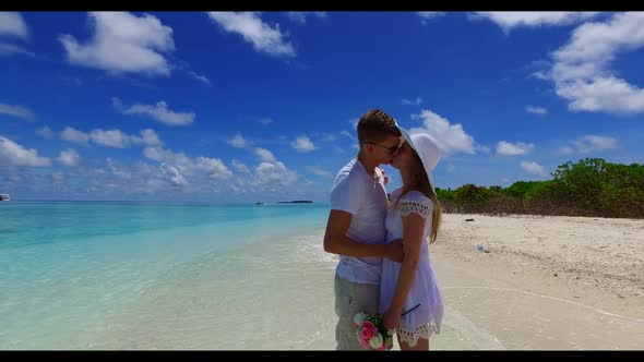 Man and lady sunbathing on perfect island beach time by blue ocean with white sandy background of th