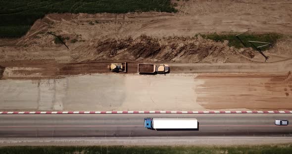 Road Construction Site Near the Highway with Machinery, Bulldozer, Excavation From Above. Video, Top