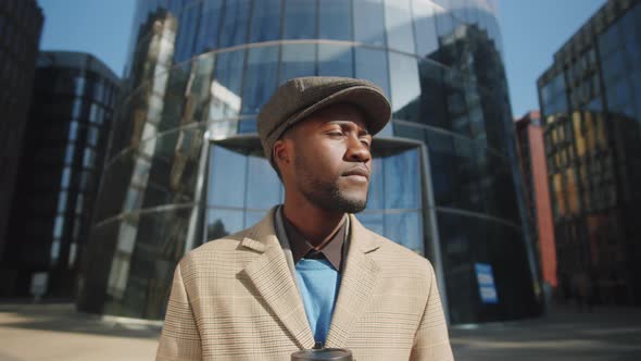 Portrait of Young Afro-American Businessman with Coffee Outdoors